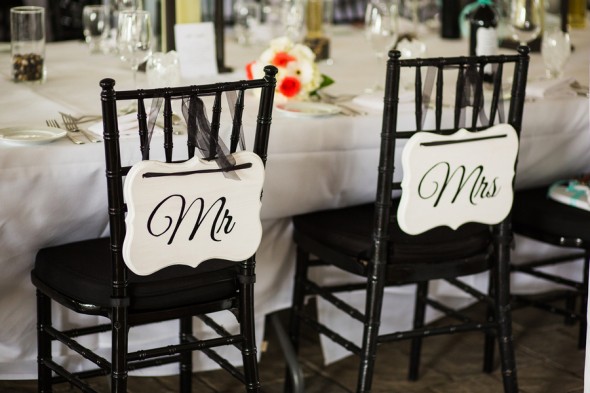 Mr. and Mrs. Signs on Chairs at Wedding Reception