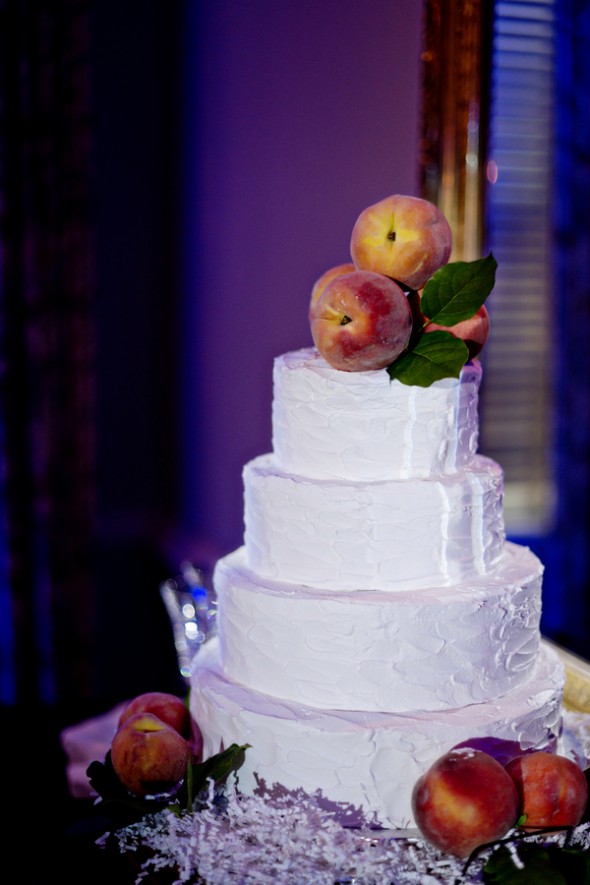 White Wedding Cake with Peaches as Cake Topper
