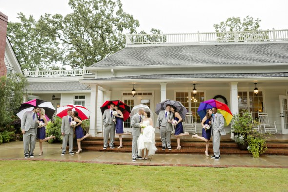 Bride and Groom and Wedding Party with Umbrellas