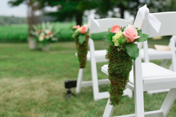 Floral Decoration on Chairs at Outdoor Wedding Ceremony